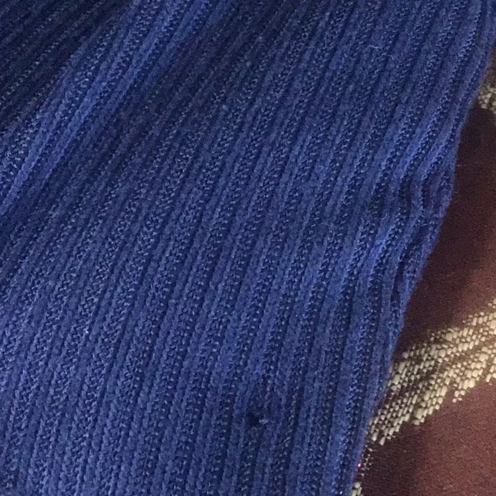 Fray features blue denim skirt with free knit top